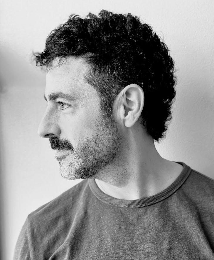 Jeff Benabio, in profile, black and white portrait